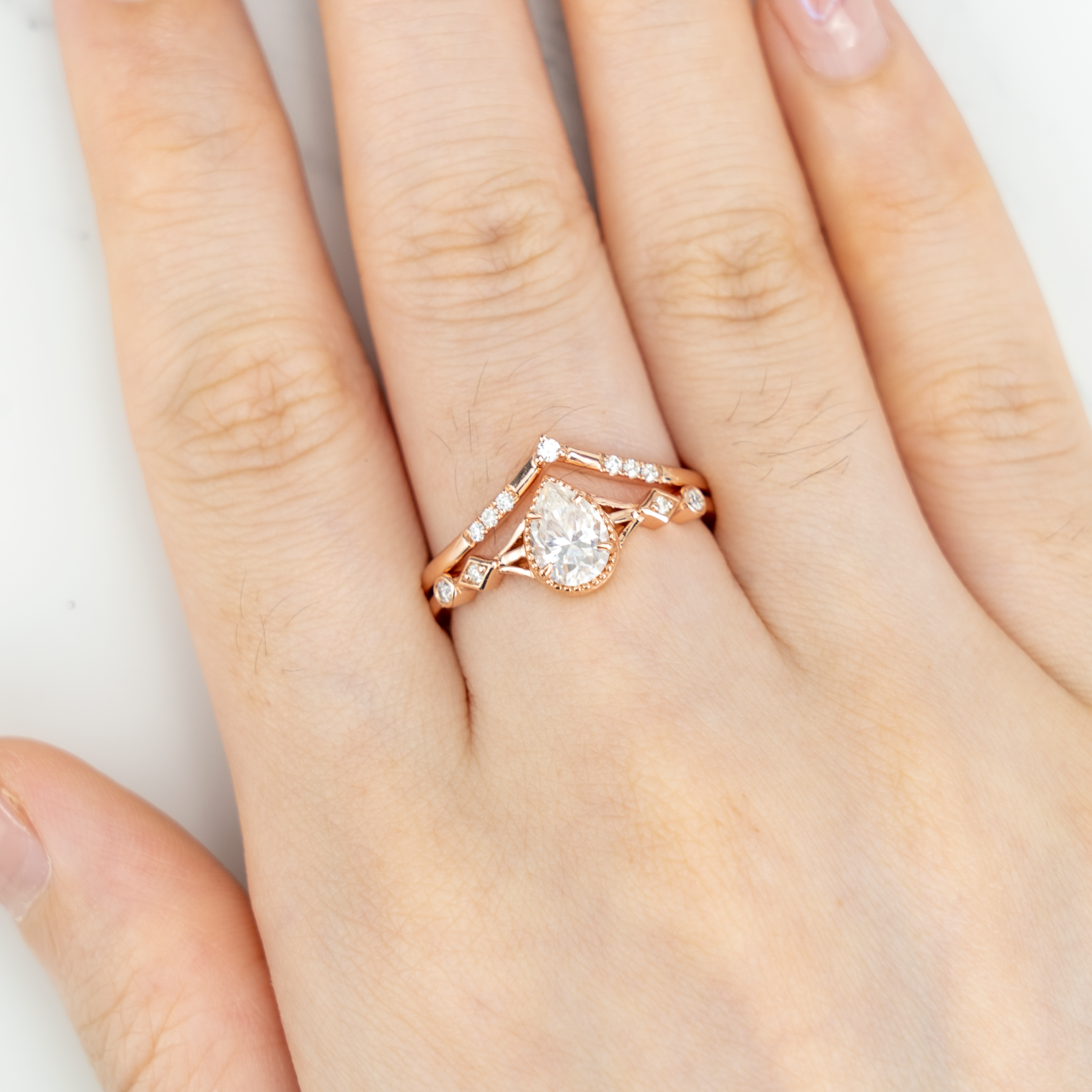 Stunning moissanite ring set with pear cut stones, showcasing timeless and classy design