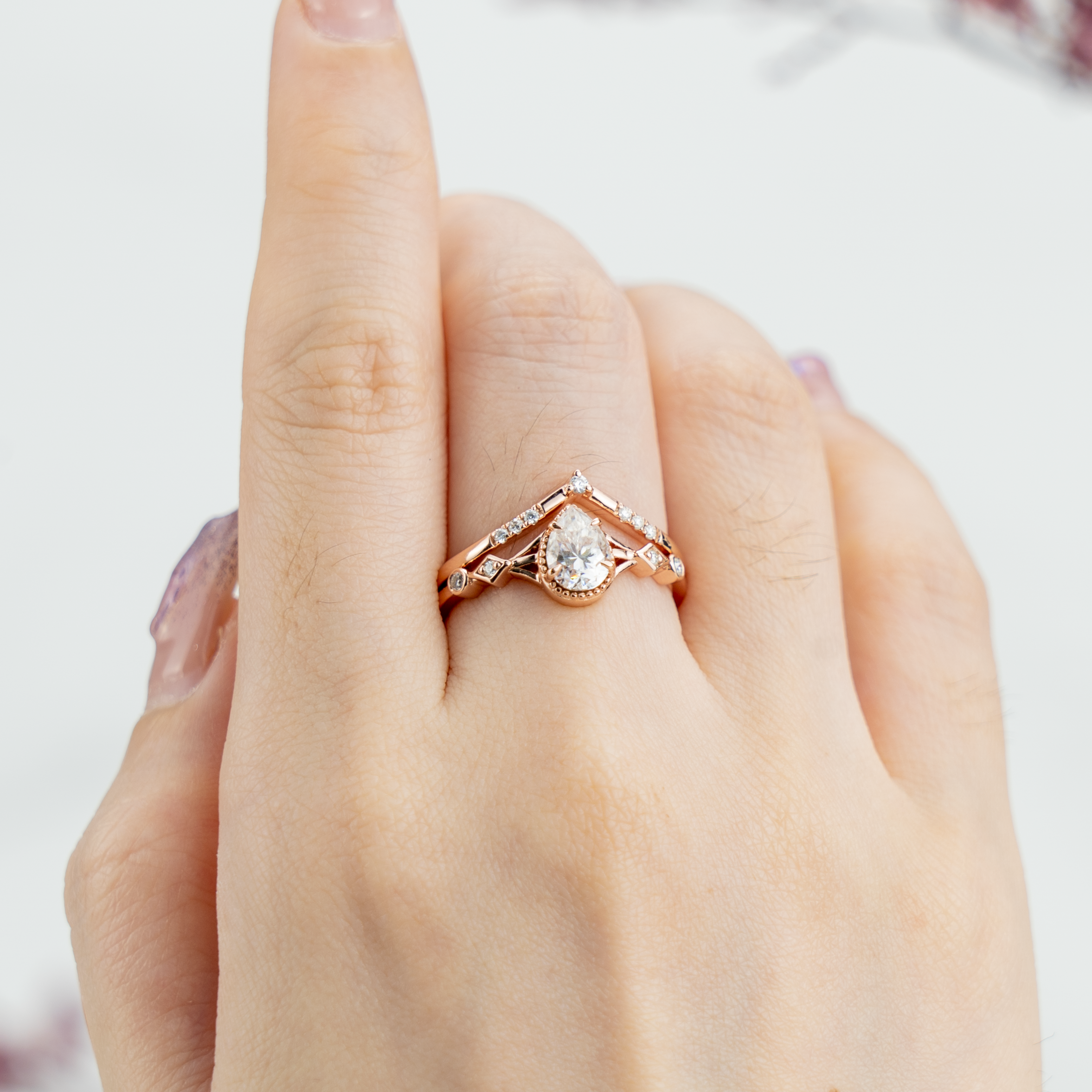 Stunning moissanite ring set with pear cut stones, showcasing timeless and classy design