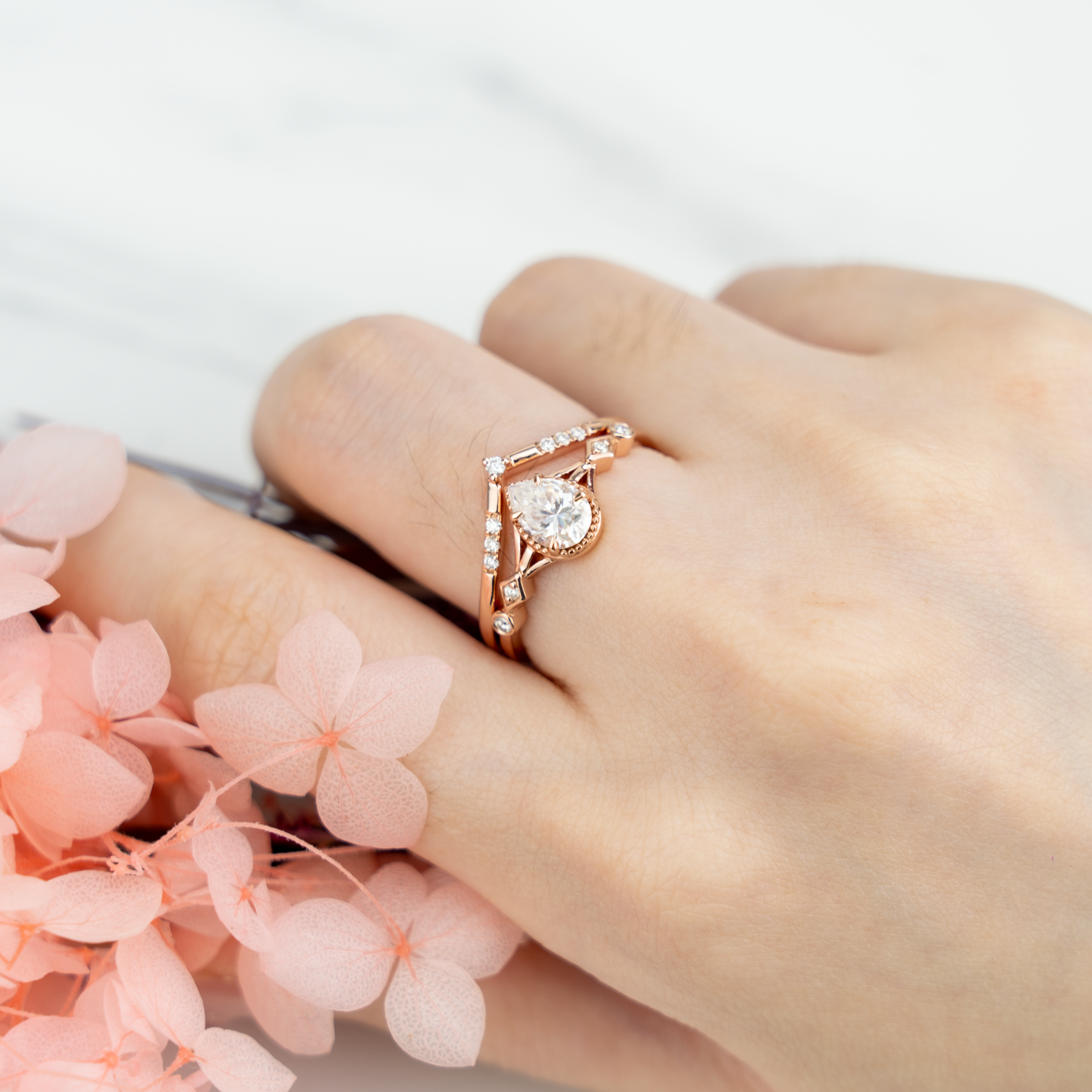 Stunning moissanite ring set with pear cut stones, showcasing timeless and classy design