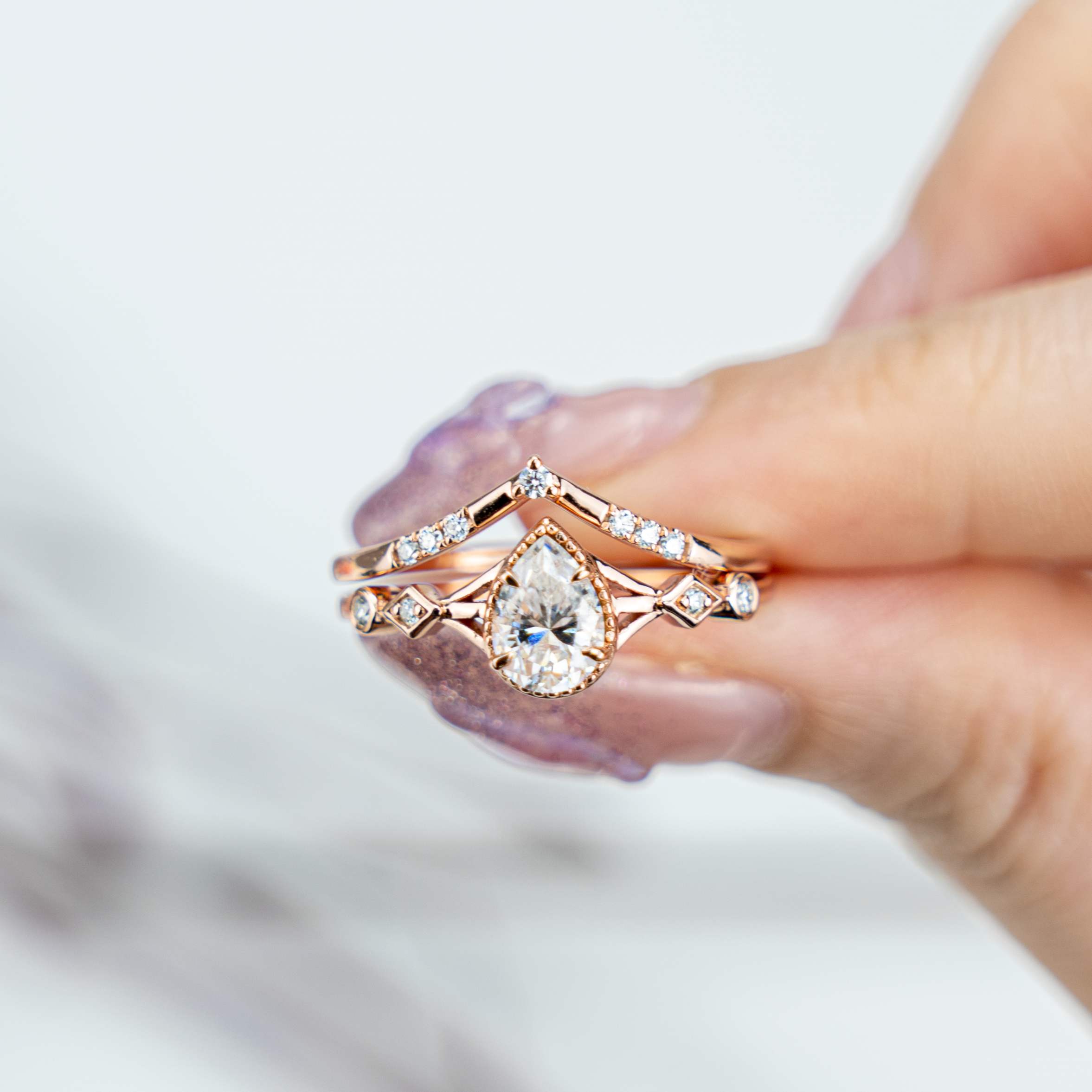 Stunning moissanite ring set with pear cut stones, showcasing timeless and classy design