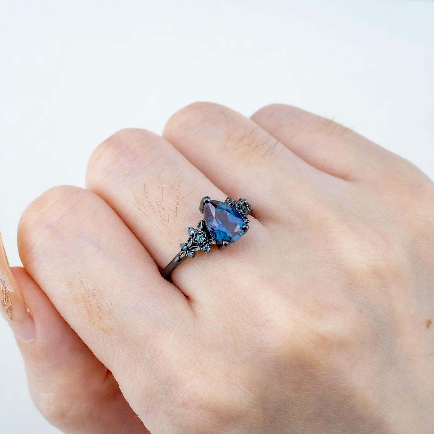Stunning pear Alexandrite engagement ring set in black gold for timeless beauty