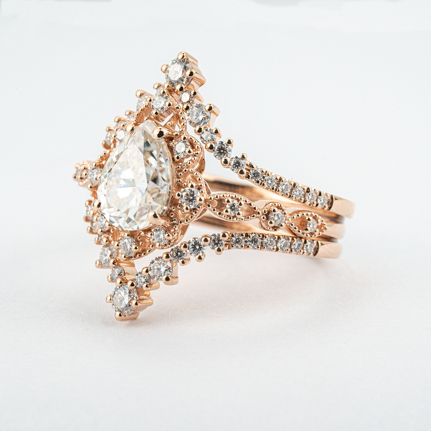 Luxurious Pear Shape Moissanite Rose Gold Three-Piece Set Unique Design Engagement Rings