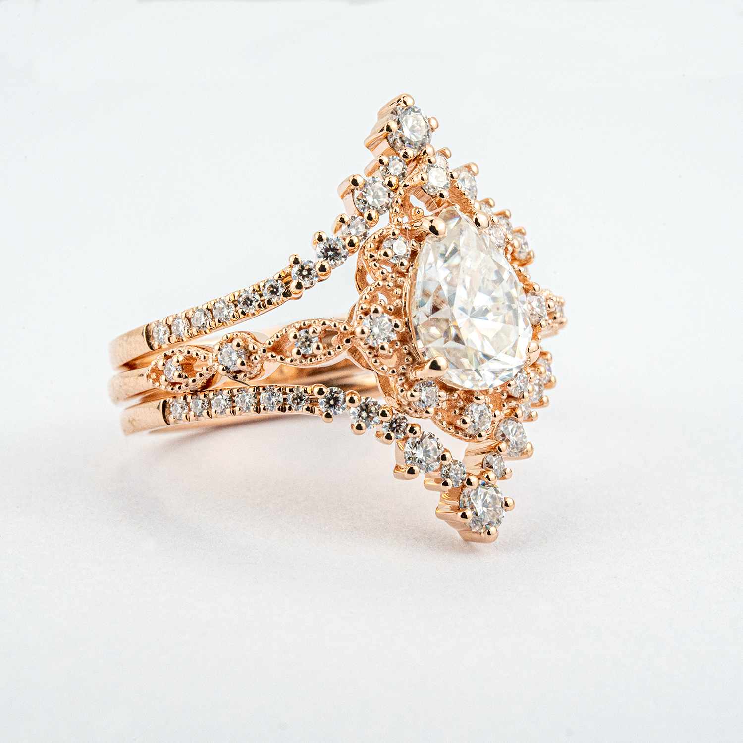 Luxurious Pear Shape Moissanite Rose Gold Three-Piece Set Unique Design Engagement Rings