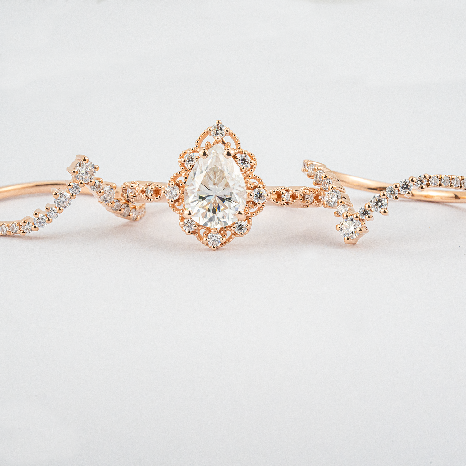 Luxurious Pear Shape Moissanite Rose Gold Three-Piece Set Unique Design Engagement Rings