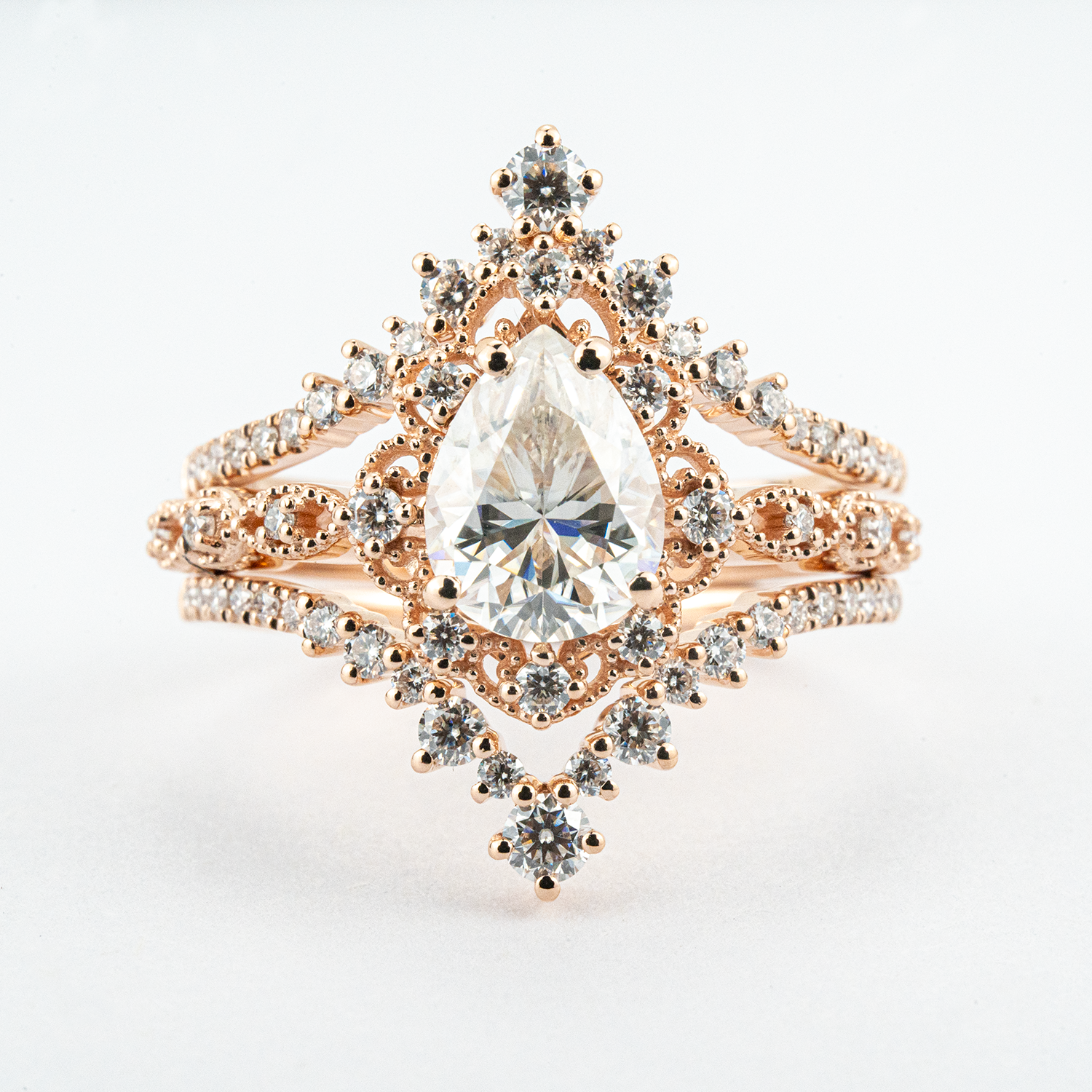 Luxurious Pear Shape Moissanite Rose Gold Three-Piece Set Unique Design Engagement Rings