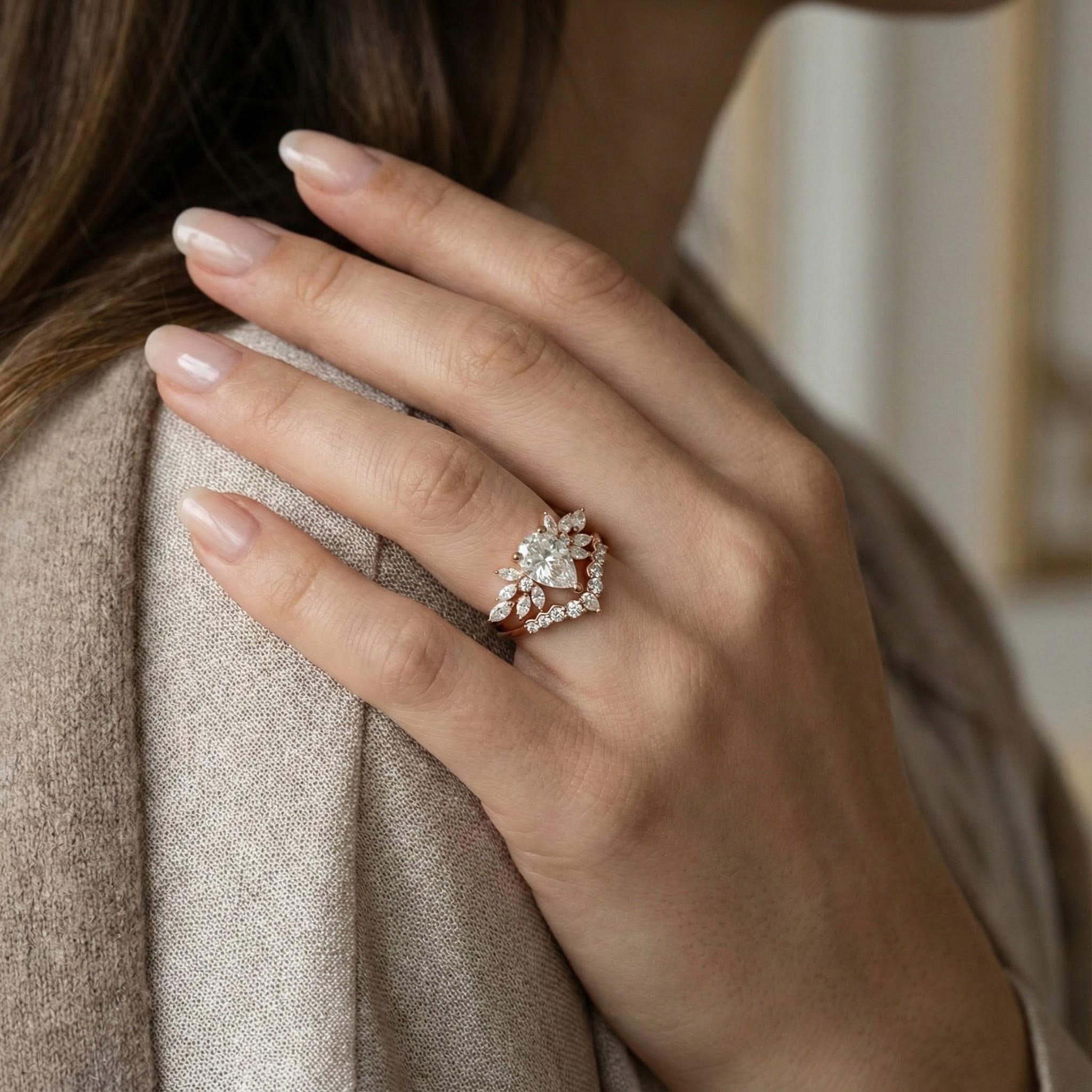 Exquisite pear moissanite ring set adorned with luxurious butterfly detail