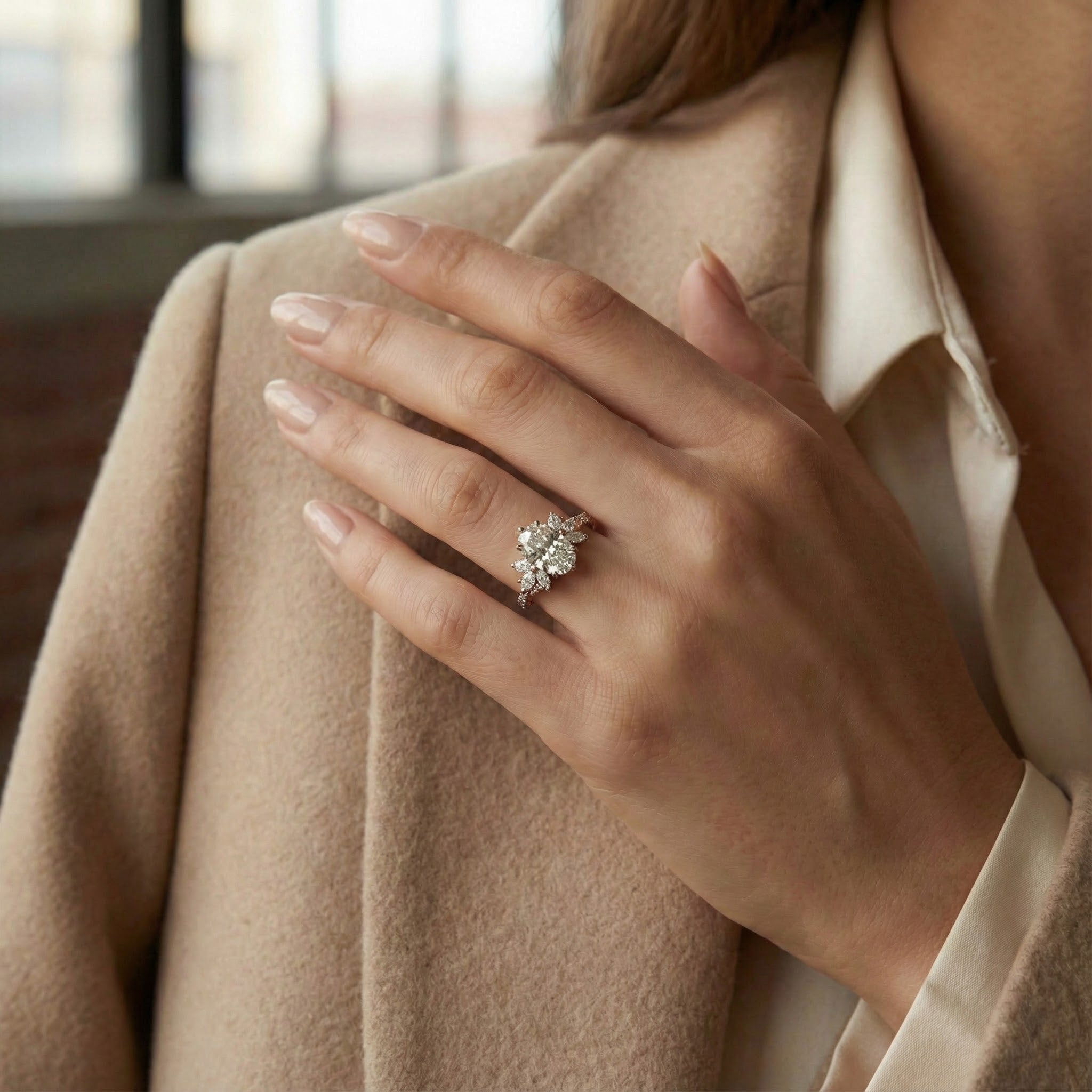 Elegant handmade oval moissanite ring featuring a delicate leaf motif, perfect for adding a touch of nature to your look.