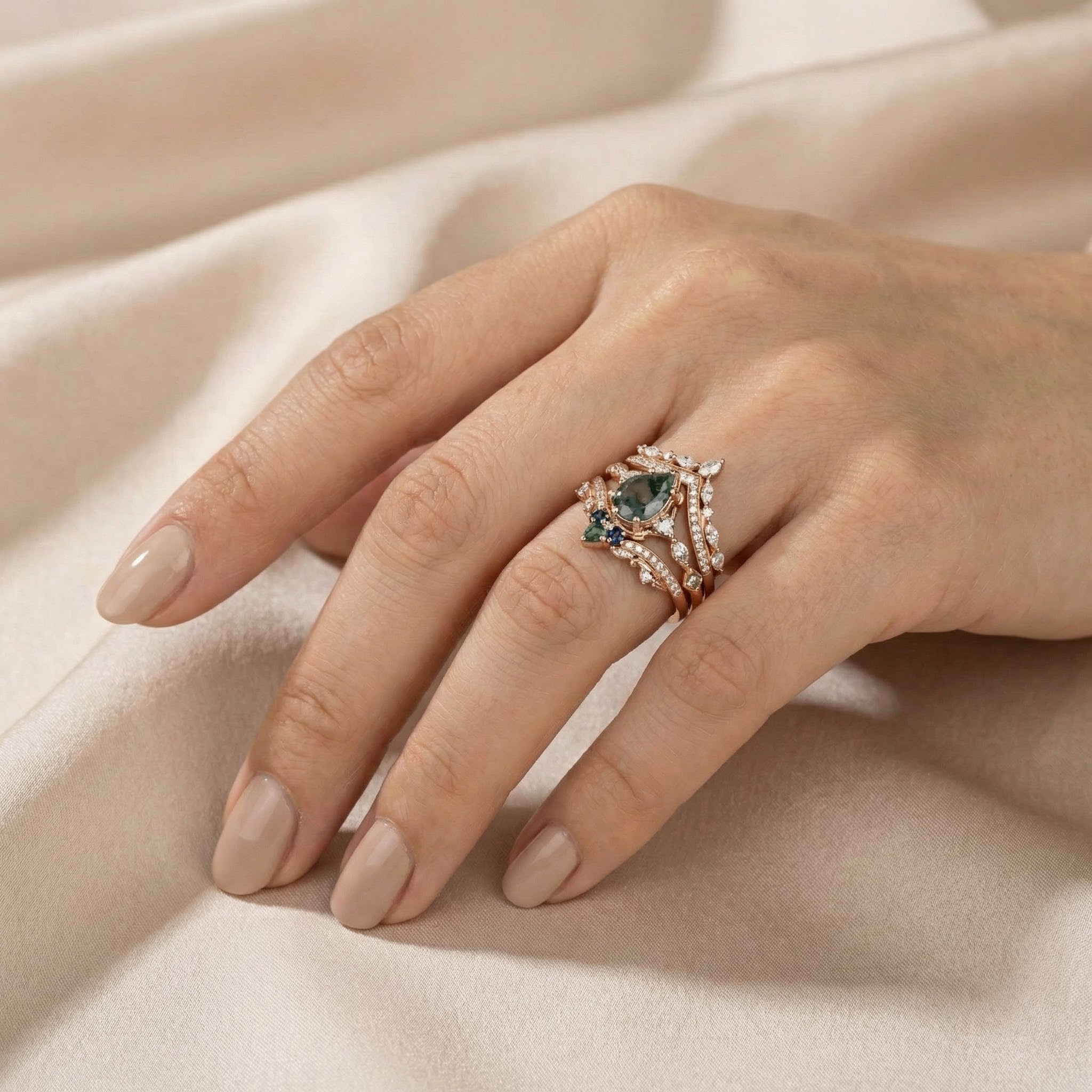 Detailed view of Pear Moss Agate Ring Set in Gold