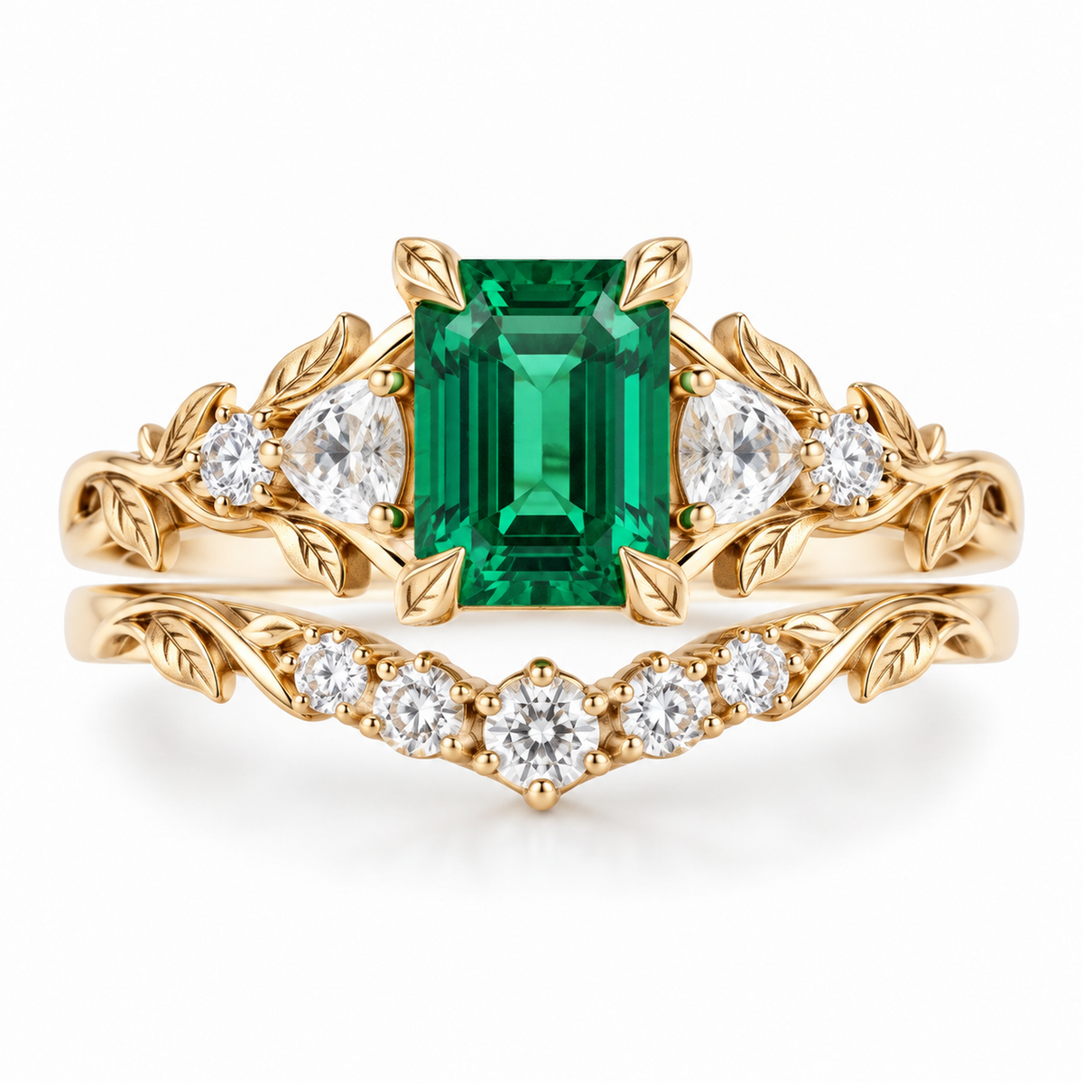 Emerald bridal ring set in yellow gold with matching curved leaf wedding band