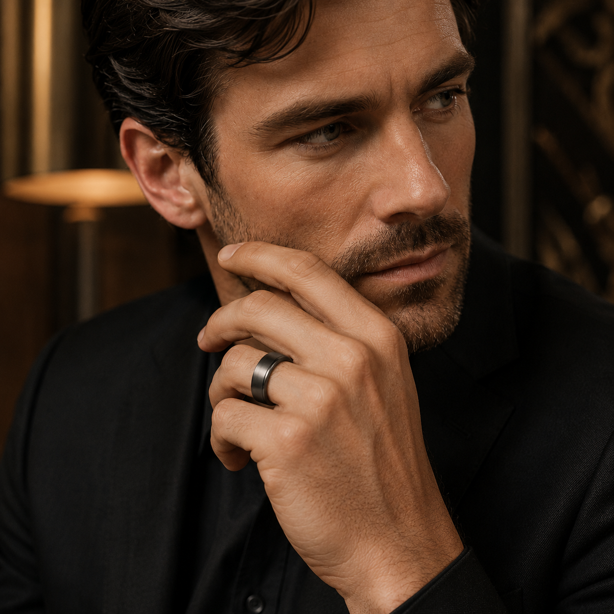 Male model wearing 10mm black gold brushed wedding band