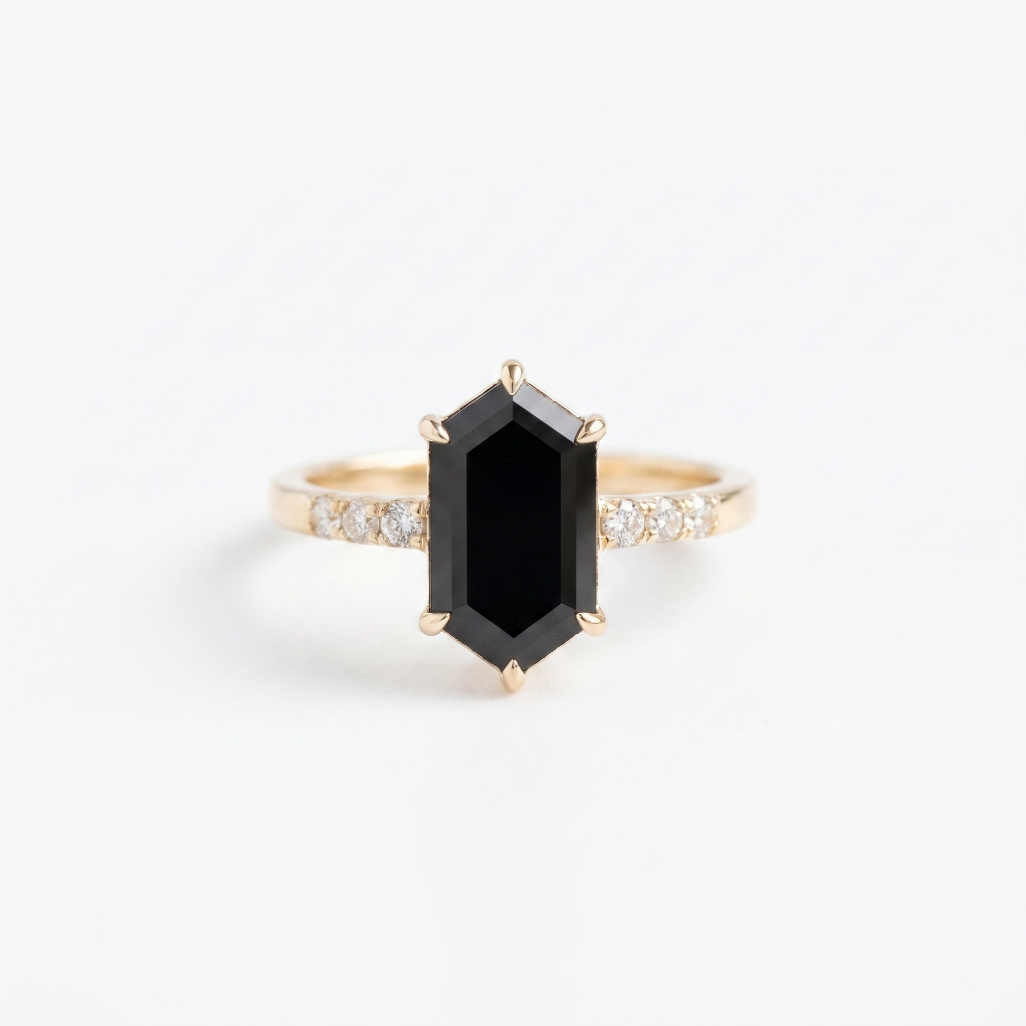 Hexagon black onyx engagement ring with gold band and diamond accent stones