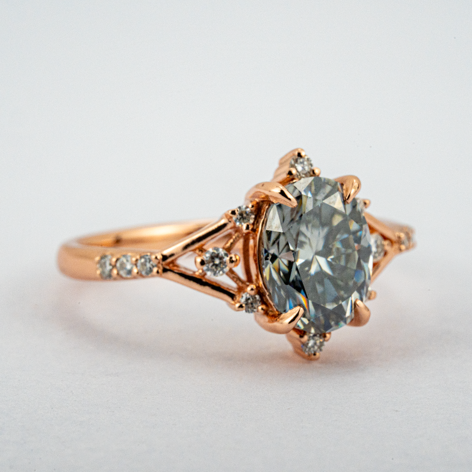 Stylish minimalist wedding band featuring an oval gray stone, chic design