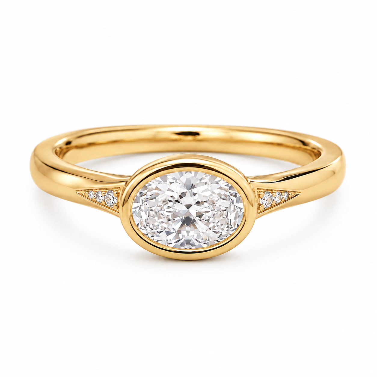 East-west oval lab-grown diamond bezel ring in yellow gold with diamond accent shoulders